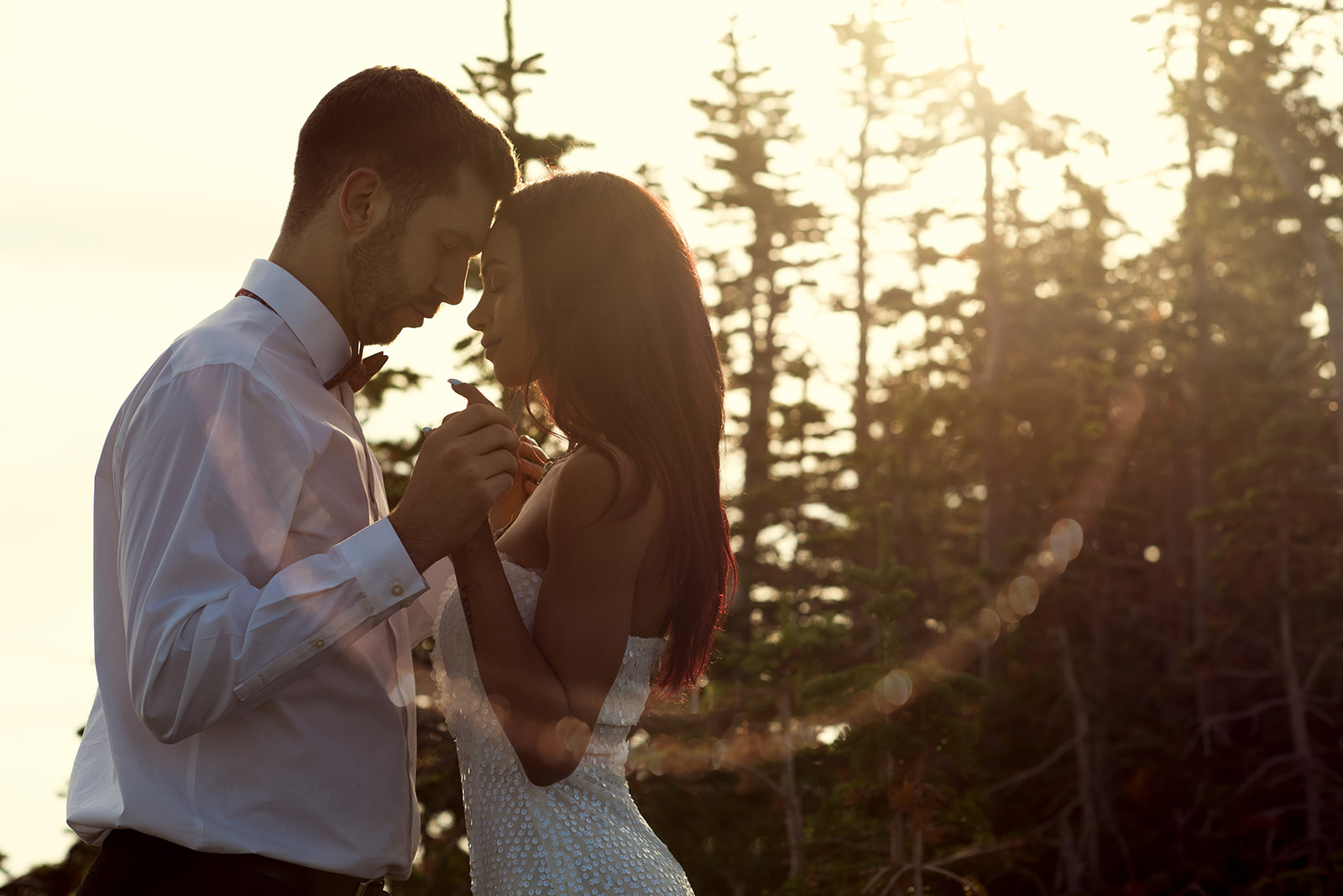 Calgary wedding photographer, couple walking in golden light in the Canadian Rockies